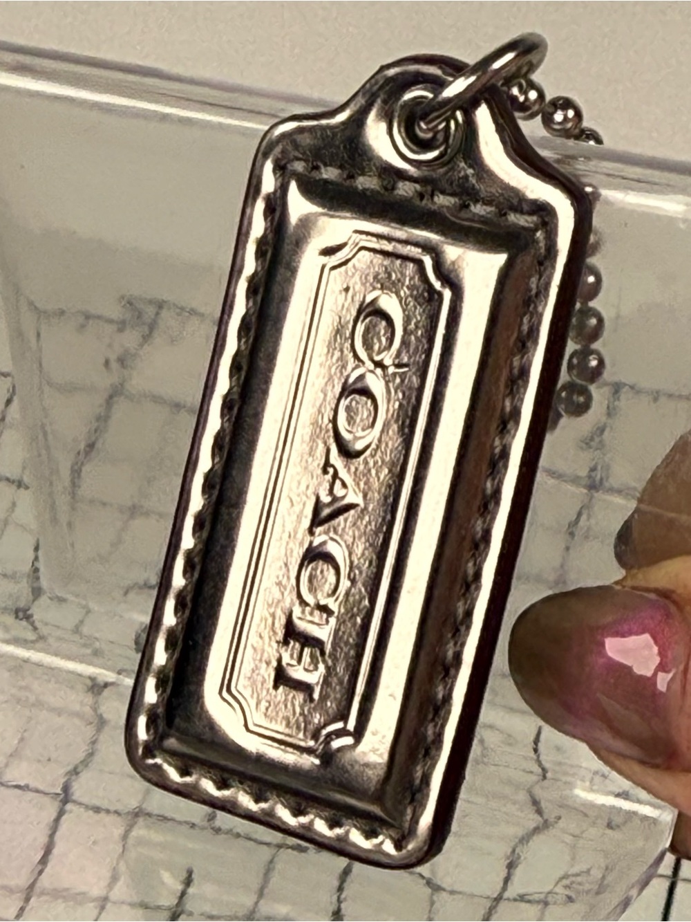 COACH gunmetal silver Leather hang Tag Keychain. 2.5 by 1 inch with chain